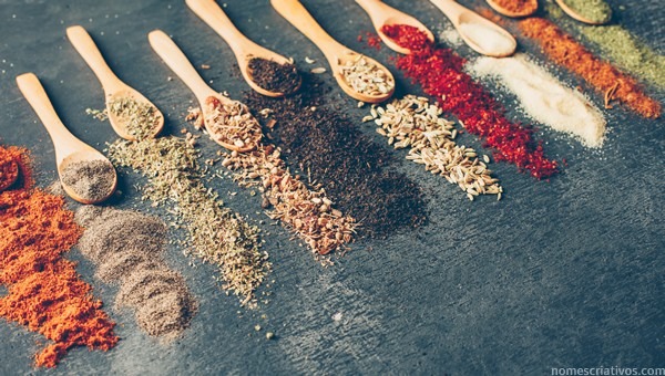 High angle view dried herbs spoons